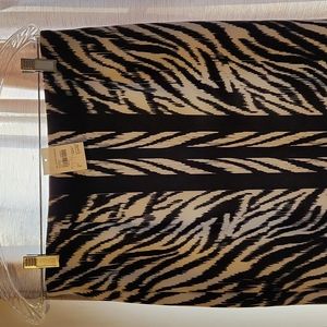 Black and white, elastic waist, pencil skirt. Size Small but fits like a medium